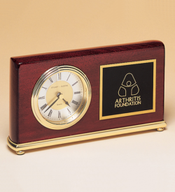 Rosewood Piano Finish Desk Clock on a Brass Base.